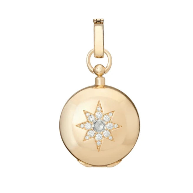 Direction Diamond Locket by Mined + Found available at Talisman Collection Fine Jewelers in El Dorado Hills, CA and online. Capture attention, touch the soul, ignite chatter and offer meaningful embellishment - this extraordinary locket is a stunning illustration. Within the 14k gold locket, a coin peeks out in a sleek, velvety finish.On the one side, a sunburst dictates "GO FOR IT." The reverse, a serene moonscape, with the message "WAIT FOR IT."&nbsp; Direction Major is decorated with an antique compass r
