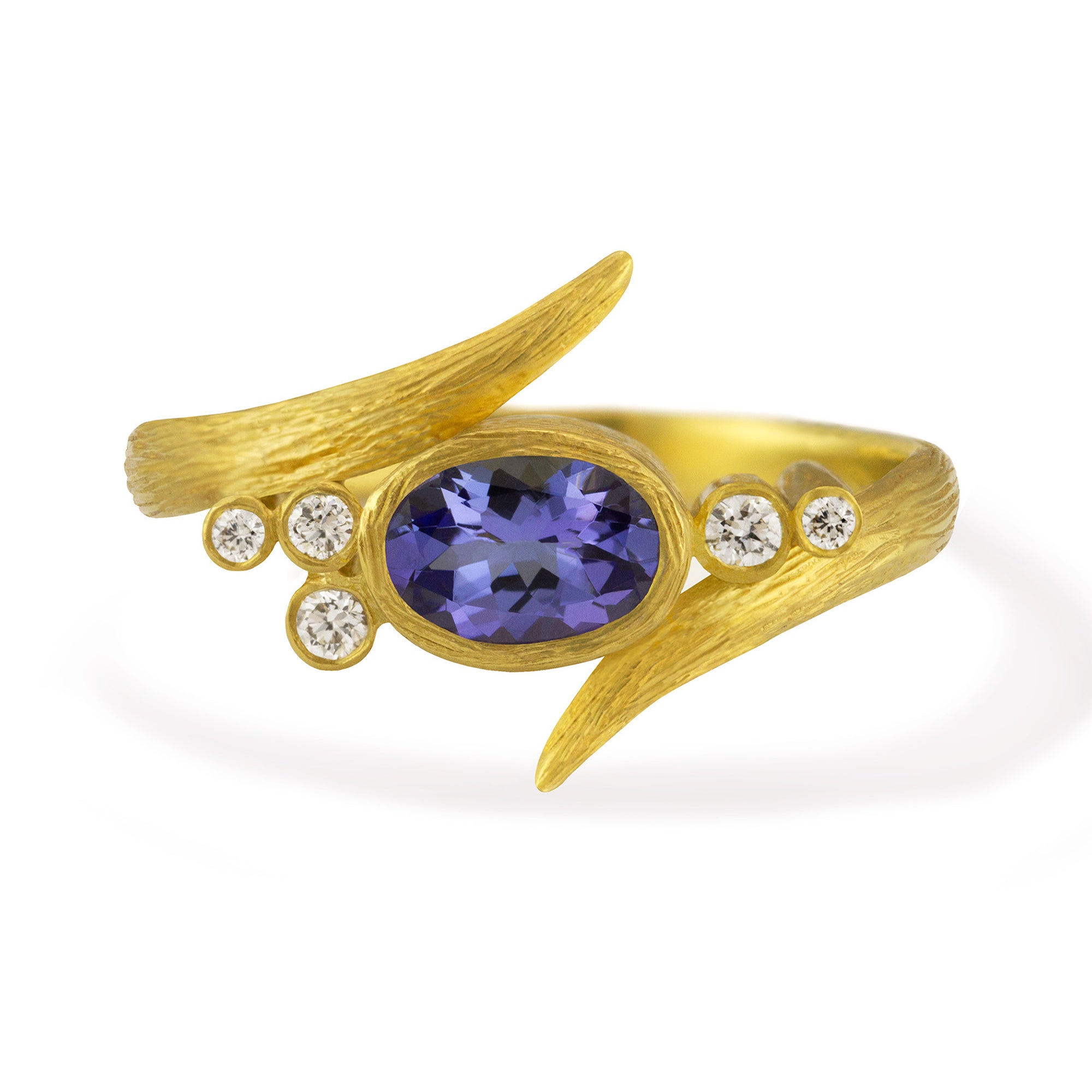 Tanzanite Vine Ring by Laurie Kaiser available at Talisman Collection Fine Jewelers in El Dorado Hills, CA and online. This Vine Ring features a sparkly oval-cut Tanzanite set on an 18k yellow gold band that delicately wraps around your finger. Accented with 0.08 cts of brilliant white diamonds, this petite ring really dazzles. The perfect bauble to make you smile every time you look at it.