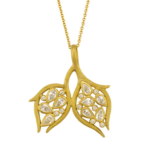 Double Leaf and Vine Pendant Necklace by Laurie Kaiser available at Talisman Collection Fine Jewelers in El Dorado Hills, CA and online.The Double Leaf and Vine Pendant Necklace embodies the beauty of nature. The pendant is embellished with glistening pear-cut diamonds totaling .90 carats and .10cts of white round brilliant diamonds all set in 18k yellow gold subtly textured vines. The 20-inch chain makes it a perfect choice for layering, or worn alone, it highlights your décolletage.