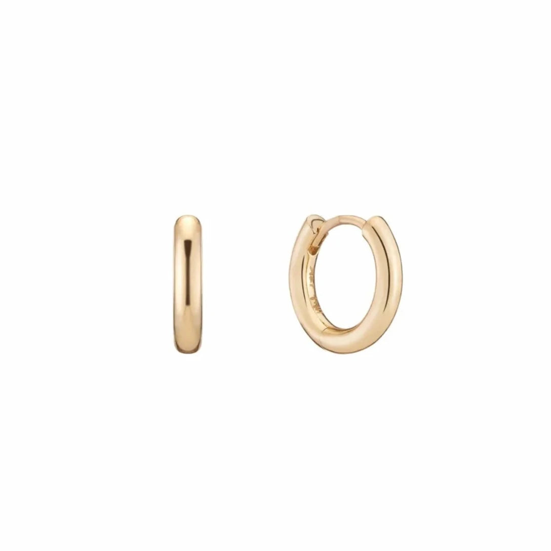 Gold Mini Hoops by Mined + Found available at Talisman Collection Fine Jewelers in El Dorado Hills, CA and online. Perfect little 14k hoop earrings perfectly hug the ear while leaving just enough room for the company of one of our gemstone charms. Hinged base design. Diameter .47".