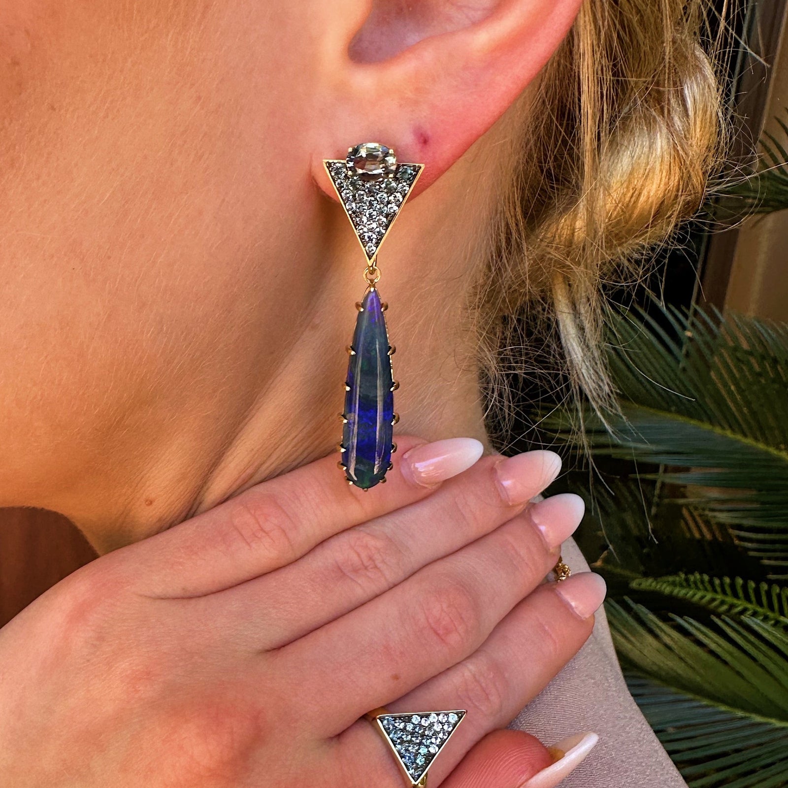 Orion’s Opal Earrings by Meredith Young available at Talisman Collection Fine Jewelers in El Dorado Hills, CA and online. A stellar combination of gemstones, Orion’s Opal Earrings are out of this world. The pave triangle tops feature 1.52 cts of gray spinels, .35 cts of denim spinel, and .6 cts of color-change garnets. Suspended below, dreamy, elongated, pear-cut opal drops hang like stars in the night sky. With classic post backs, these earrings are both comfortable and offer a touch of cosmic wonder.