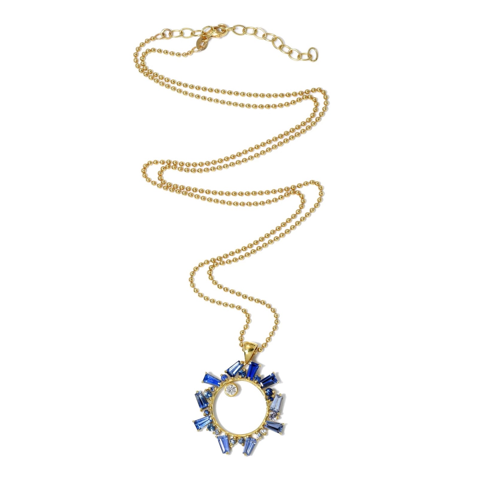 Gold necklace with a blue gemstone pendant on a white background