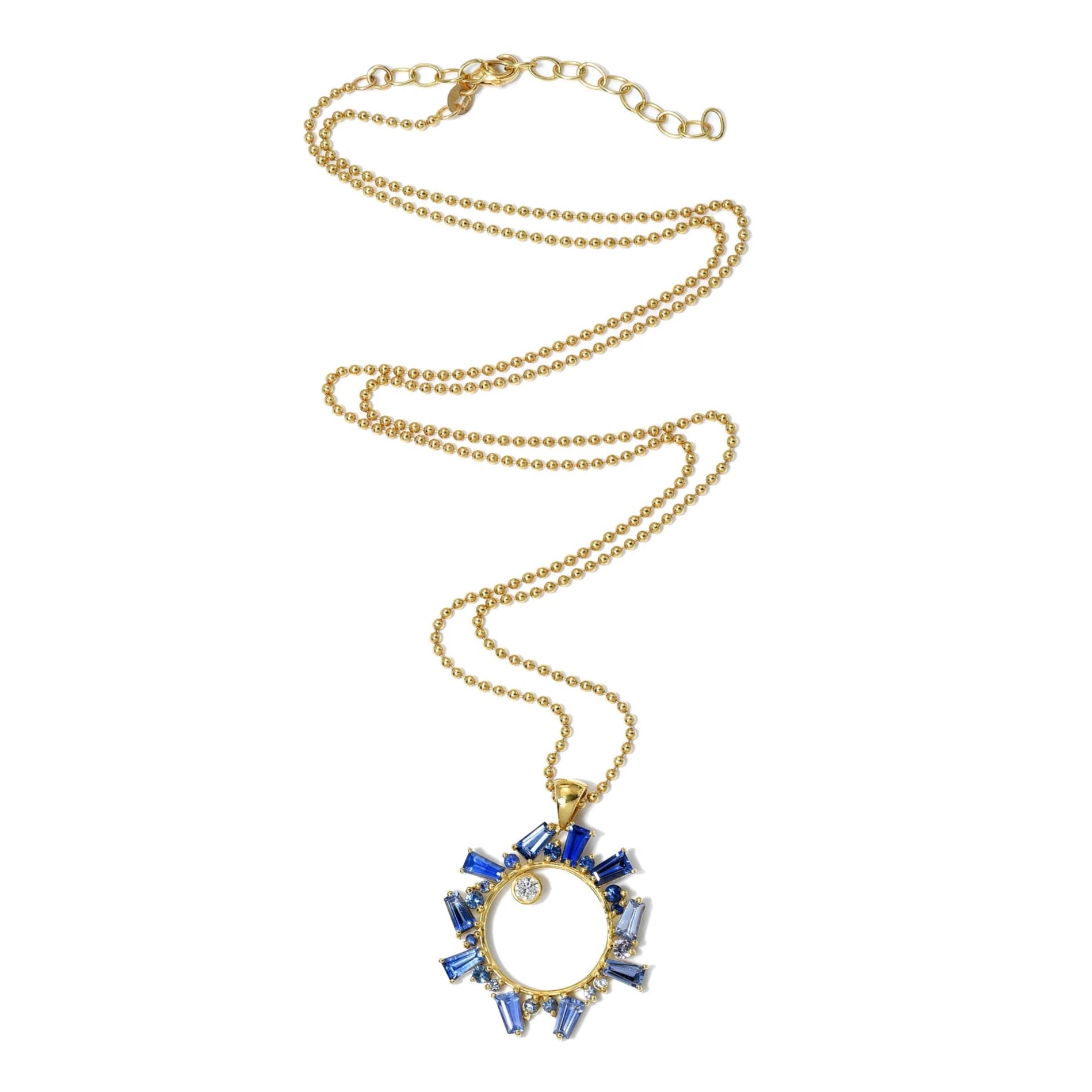 Open Circle Blue Ombre Sapphire Necklace by Meredith Young available at Talisman Collection Fine Jewelers in El Dorado Hills, CA and online. The pure beauty of this necklace brings a sense of serenity... Ombre-hued blue sapphires gently undulate around an 18k gold open circle evoking the tranquil essence of the sea. A single off-set diamond, with a total weight of 0.15 carats, adds a touch of brilliance to the pendant suspended on a ball chain.