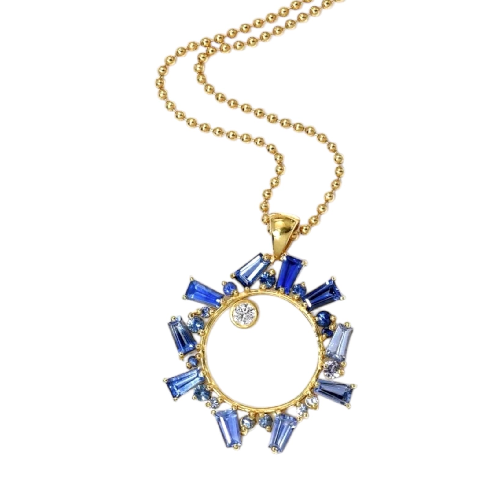 Gold necklace with a blue gemstone pendant on a white background