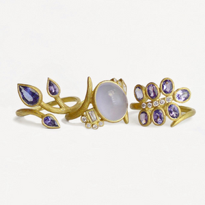 Lavender Chalcedony Vine Ring by Laurie Kaiser available at Talisman Collection Fine Jewelers in El Dorado Hills, CA and online. Made from 18k yellow gold, it features a luminescent lavender chalcedony stone that's accented with 0.18 carats of white brilliant-cut and baguette diamonds, giving it an extra sparkle. The unique vine design adds an air of sophistication to the ring making it a piece you'll treasure forever.