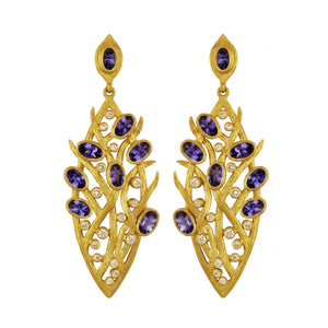 Tanzanite Lemongrass Marquis Earrings by Laurie Kaiser available at Talisman Collection Fine Jewelers in El Dorado Hills, CA and online. Lavished with multiple tanzanite stones and 0.49 cts of white brilliant diamonds set in 18k yellow gold, these earrings are the epitome of luxury. Classic post backs ensure they will sit beautifully on your ear. 