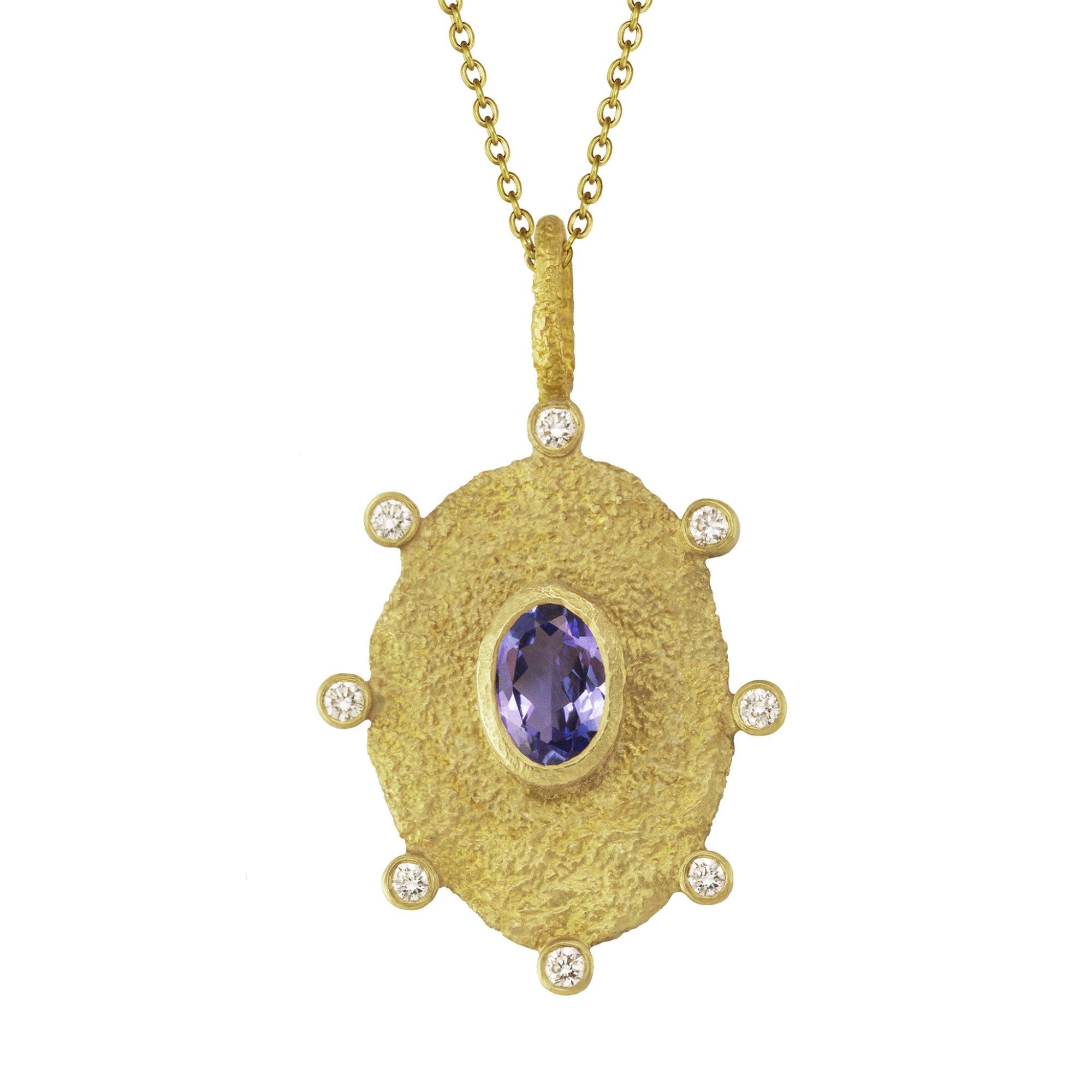 Rustic Tanzanite Necklace by Laurie Kaiser available at Talisman Collection Fine Jewelers in El Dorado Hills, CA and online.This pendant necklace features an oval cut tanzanite and 0.12 carats of brilliant white diamonds, all set in 18k gold. The organic shaped oval pendant hangs from a delicate 16" yellow gold chain. This necklace will add a touch of natural beauty to any outfit.