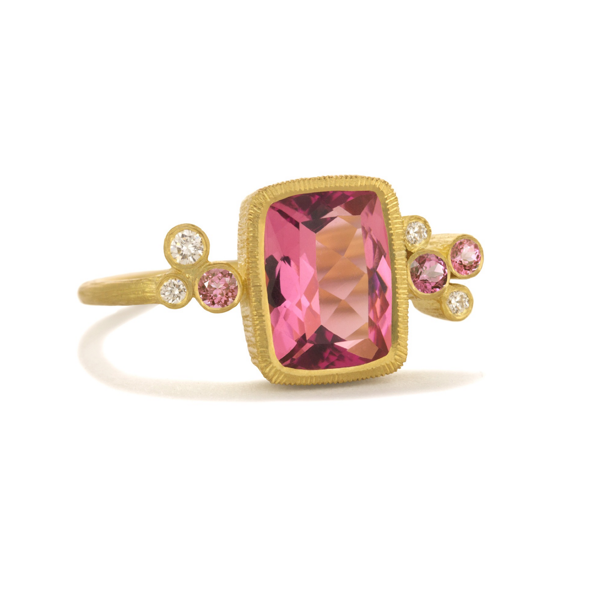 Pink Sprinkles Ring by Laurie Kaiser available at Talisman Collection Fine Jewelers in El Dorado Hills, CA and online. An emerald cut Brazilian pink fluorite takes center stage in the Pink Sprinkles Ring, while white diamonds (0.06 cts) and pink sapphires (0.10 cts) delicately frame the stone. Set in 18k yellow gold, this ring is perfect for adding a pop of color to any outfit. 