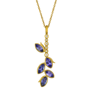 Tanzanite Vine Bar Necklace by Laurie Kaiser available at Talisman Collection Fine Jewelers in El Dorado Hills, CA and online. The modern, linear design of the Tanzanite Vine Bar Necklace is accented with dazzling tanzanites and .08 cts of white brilliant diamonds set in 18k yellow gold. With a 19" chain,  it's a perfect length to layer. This special piece is sure to become a cherished addition to your jewelry box.