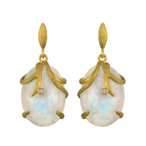 Rainbow Moonstone Vine Wrapped Oval Earrings by Laurie Kaiser available at Talisman Collection Fine Jewelers in El Dorado Hills, CA and online. The combination of rainbow moonstones and white diamonds set in 18k yellow gold creates a stunning yet subtle design that is perfect for everyday wear. With a total diamond weight of 0.03 carats, these earrings will add just the right amount of sparkle to your look.