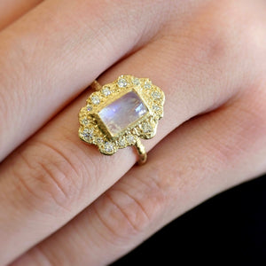 Rustic Moonstone Ring by Laurie Kaiser available at Talisman Collection Fine Jewelers in El Dorado Hills, CA and online. The Rustic Moonstone Ring exudes vintage charm with its elegant ruffle of 18k yellow gold and dreamy rainbow moonstone center. Accented with 0.27 cts of sparkling white diamonds, this ring is the perfect balance of timeless elegance and rustic charm.