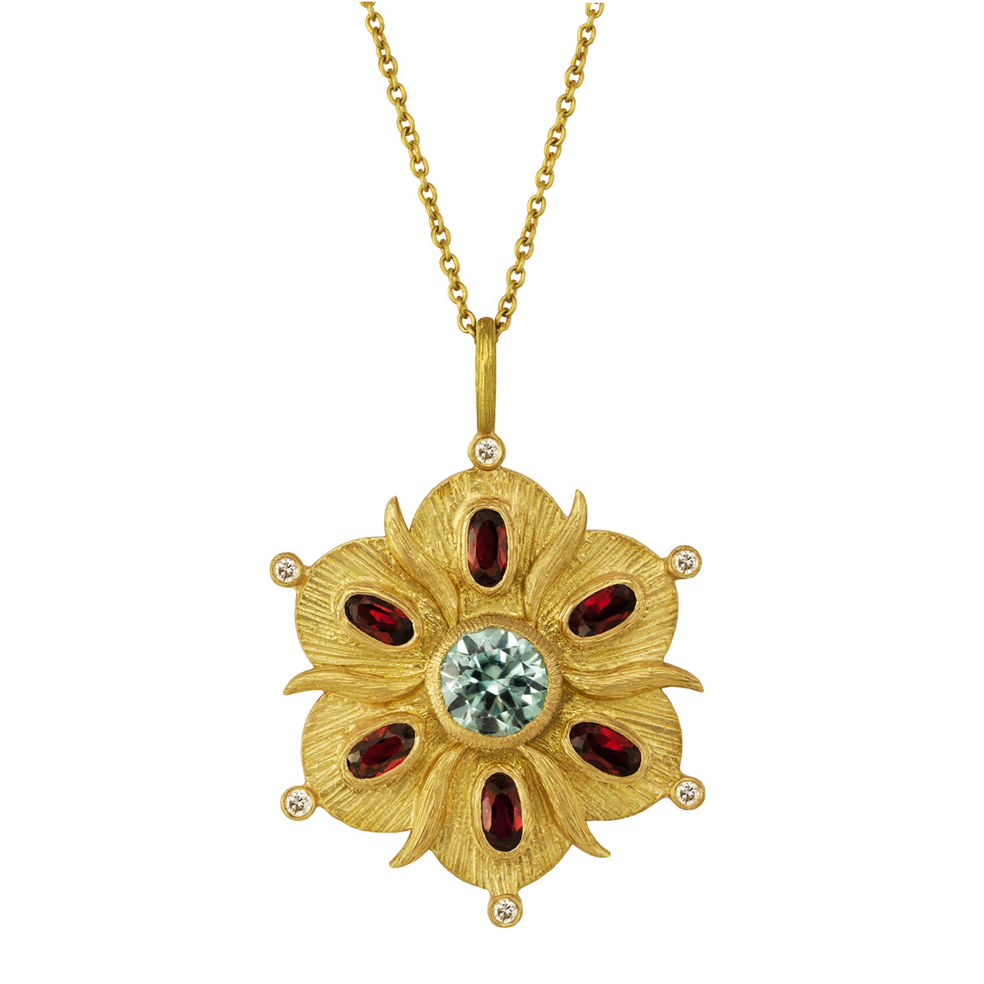 Scalloped Bloom Necklace by Laurie Kaiser available at Talisman Collection Fine Jewelers in El Dorado Hills, CA and online. The Scalloped Bloom Necklace evokes an antique feel and features a flower-shaped pendant with a soft green spinel in the center. The petals are adorned with deep red garnets and 0.06 cts of white brilliant diamonds. The pendant is crafted in 18k yellow gold and hangs on a fine 17" chain and captures the beauty of a bygone era.