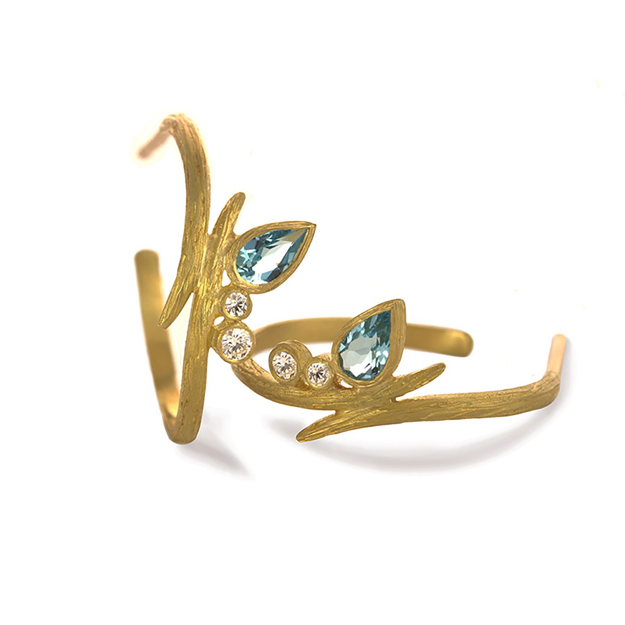 Sky Blue Topaz Vine Hoop Earrings by Laurie Kaiser available at Talisman Collection Fine Jewelers in El Dorado Hills, CA and online. These playful earrings are made of 18k yellow gold and feature bright, sky blue topaz stones, accented with 0.09 carats of brilliant white diamonds. The hoop diameter is 0.75 inches, making them the perfect size for everyday wear.