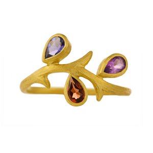 Vine Multi-Color Ring by Laurie Kaiser available at Talisman Collection Fine Jewelers in El Dorado Hills, CA and online. This delicate 18k yellow gold ring features three pear-shaped gems arranged on a vine inspired band. The stones - tanzanite, garnet, and amethyst - complement each other creating a perfect harmony of colors. 
